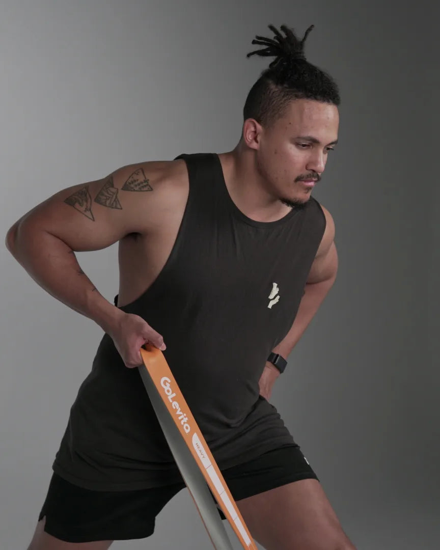 Athlete rowing with the orange GoLevita power band